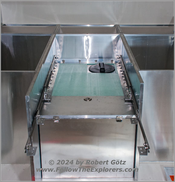 Shelter drawer runners above water tank Shelter drawer runners above water tank
