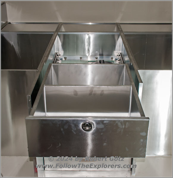 Shelter drawer above water tank Shelter drawer above water tank