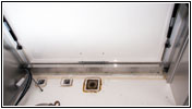 Shelter rear storage cable conduit driver side